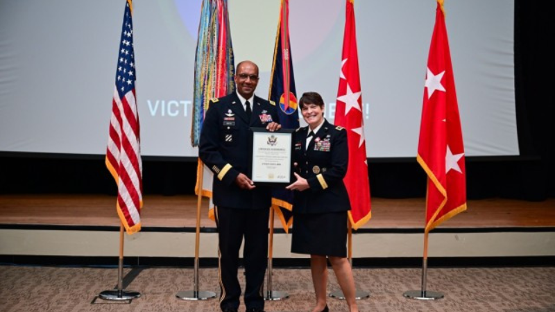 Gen. Gary Brito presents Lt. Gen. Maria Gervais with her Presidential Letter of Appreciation, or retirement letter, at her retirement ceremony on June 28, 2024.